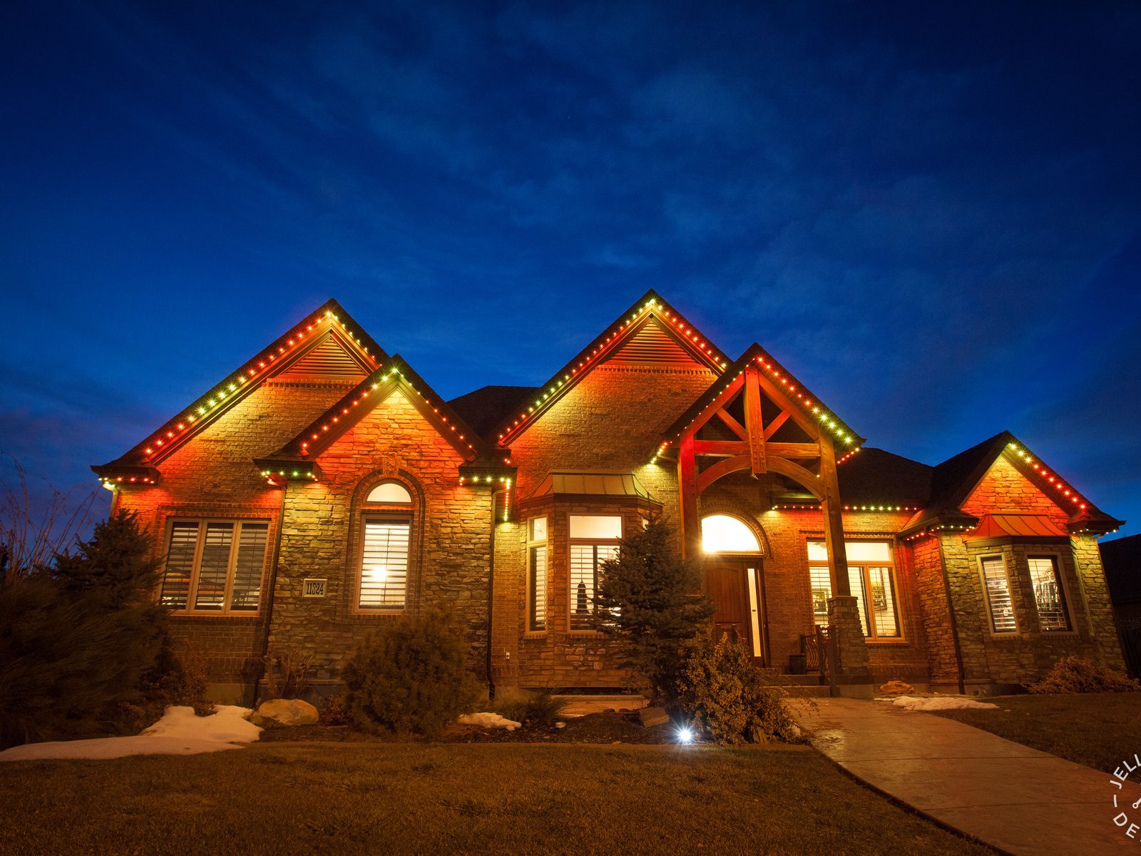 A home in the Fargo metro with JellyFish permanent lighting along the roofline at dusk